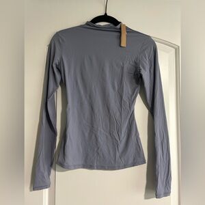 Skims light blue long sleeve body hugging top
